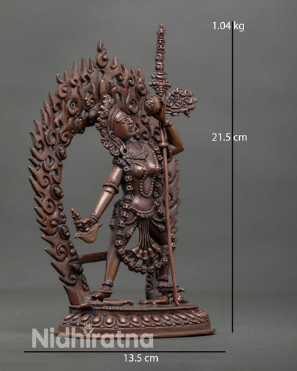 Side view of Vajrayogini statue with trident in oxidized copper, Vajrayana altar decor.