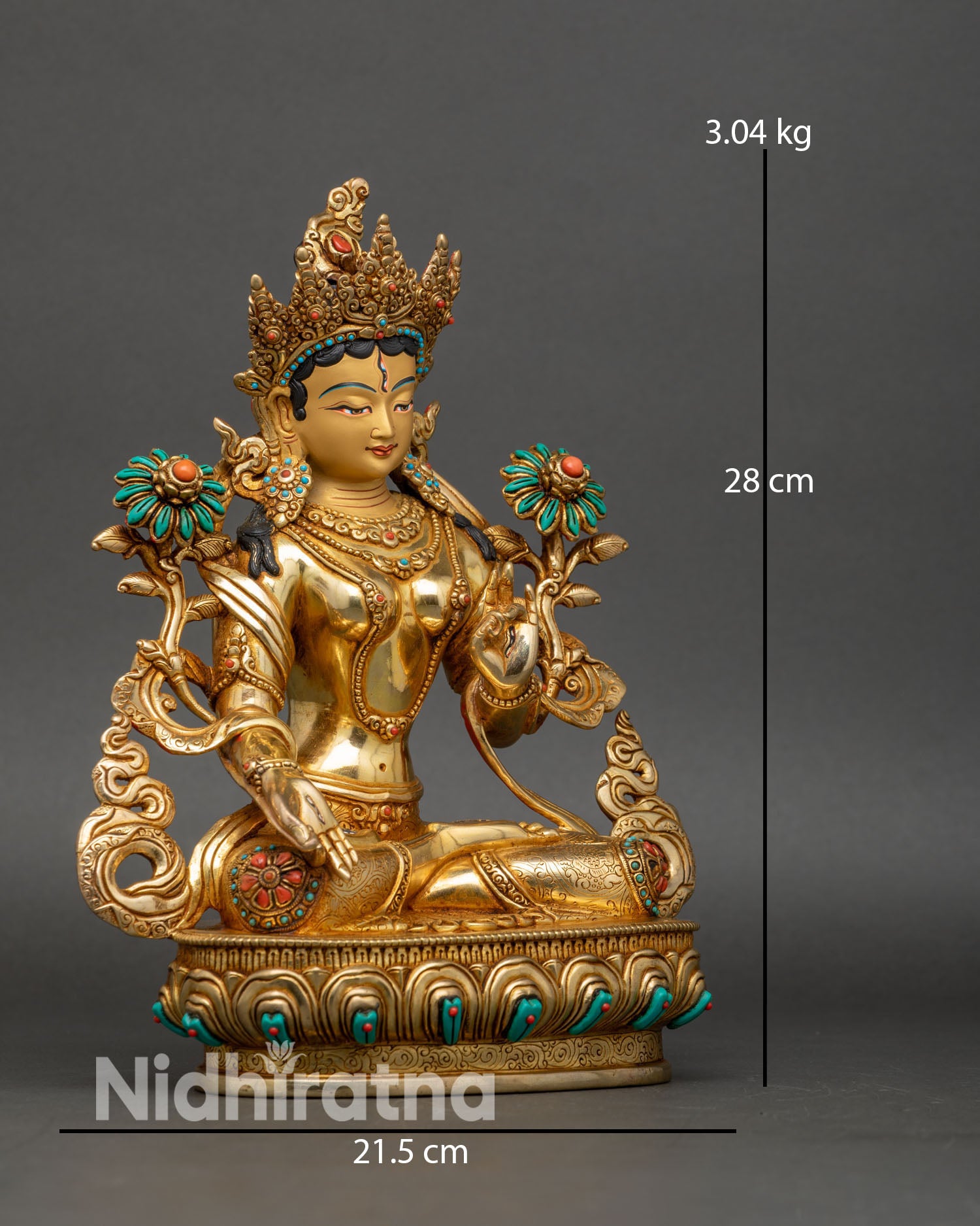 Side view of White Tara seated on lotus pedestal showing intricate hand carved robes