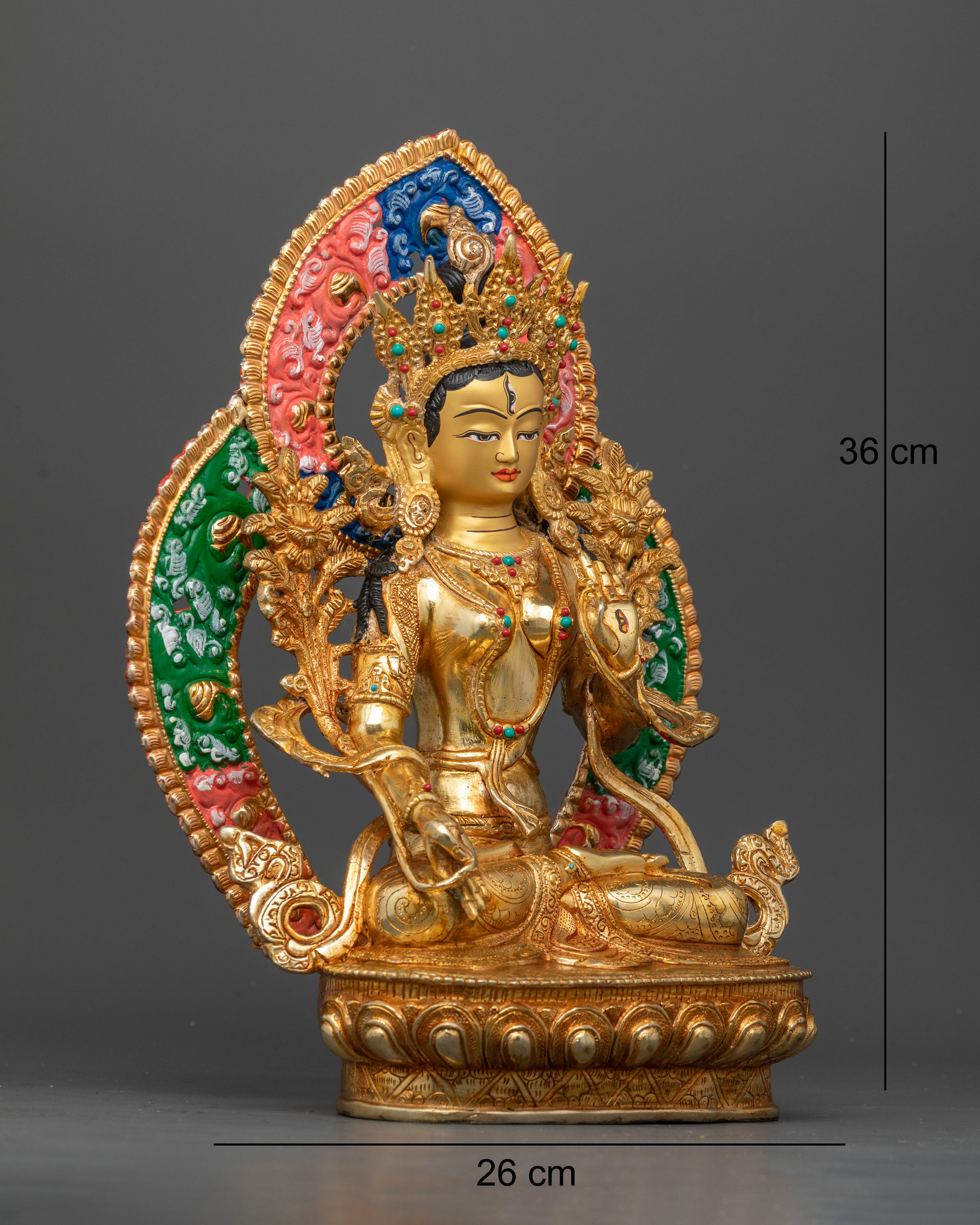 Side view of White Tara seated on lotus pedestal with ornate floral halo