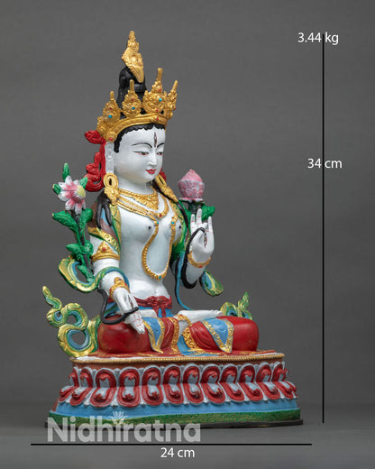 Side view of White Tara statue highlighting flowing robes, lotus base, and carefully set semi-precious stone embellishments.