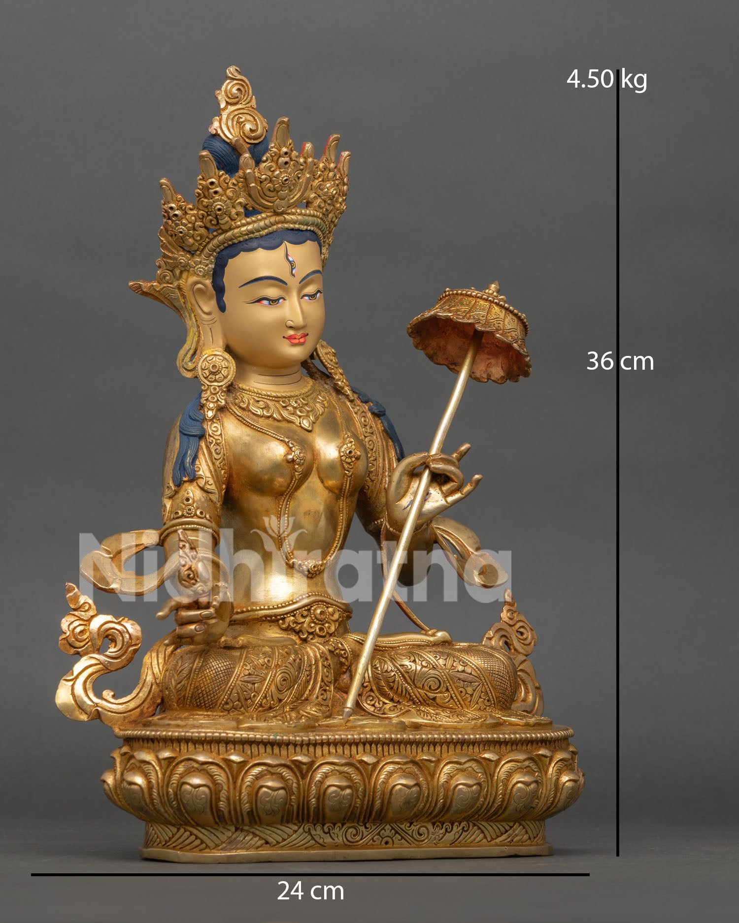 side view of white umbrella goddess dukar statue with sacred parasol