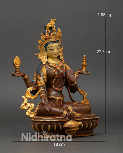 Side view of oxidized copper Laxmi statue traditional Himalayan goddess of prosperity sculpture with detailed ornaments and sacred symbolism