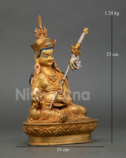 Side View of Padmasambhava Statue Holding Vajra and Kalash with Trident