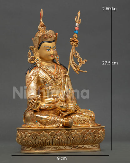 Side view of Padmasambhava statue seated on lotus with sacred objects and intricate copper artwork from Nepal