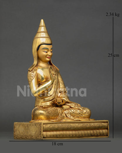 Side view of Santaraksita statue holding Vajrayana scriptures with Abhaya Mudra in Himalayan Buddhist art tradition