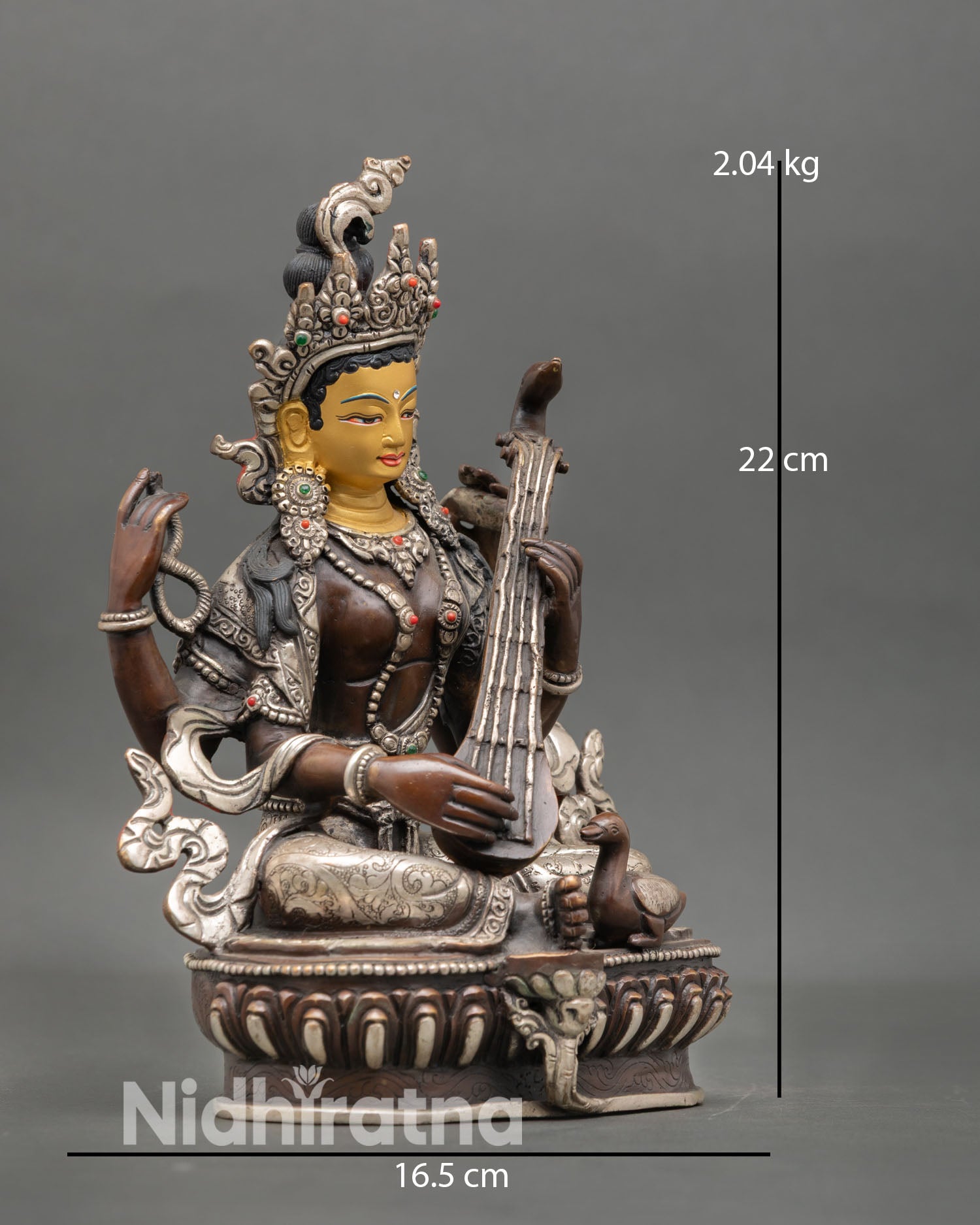 Side view Saraswati holding vina lotus seat copper statue oxidized silver detail for learning spiritual focus