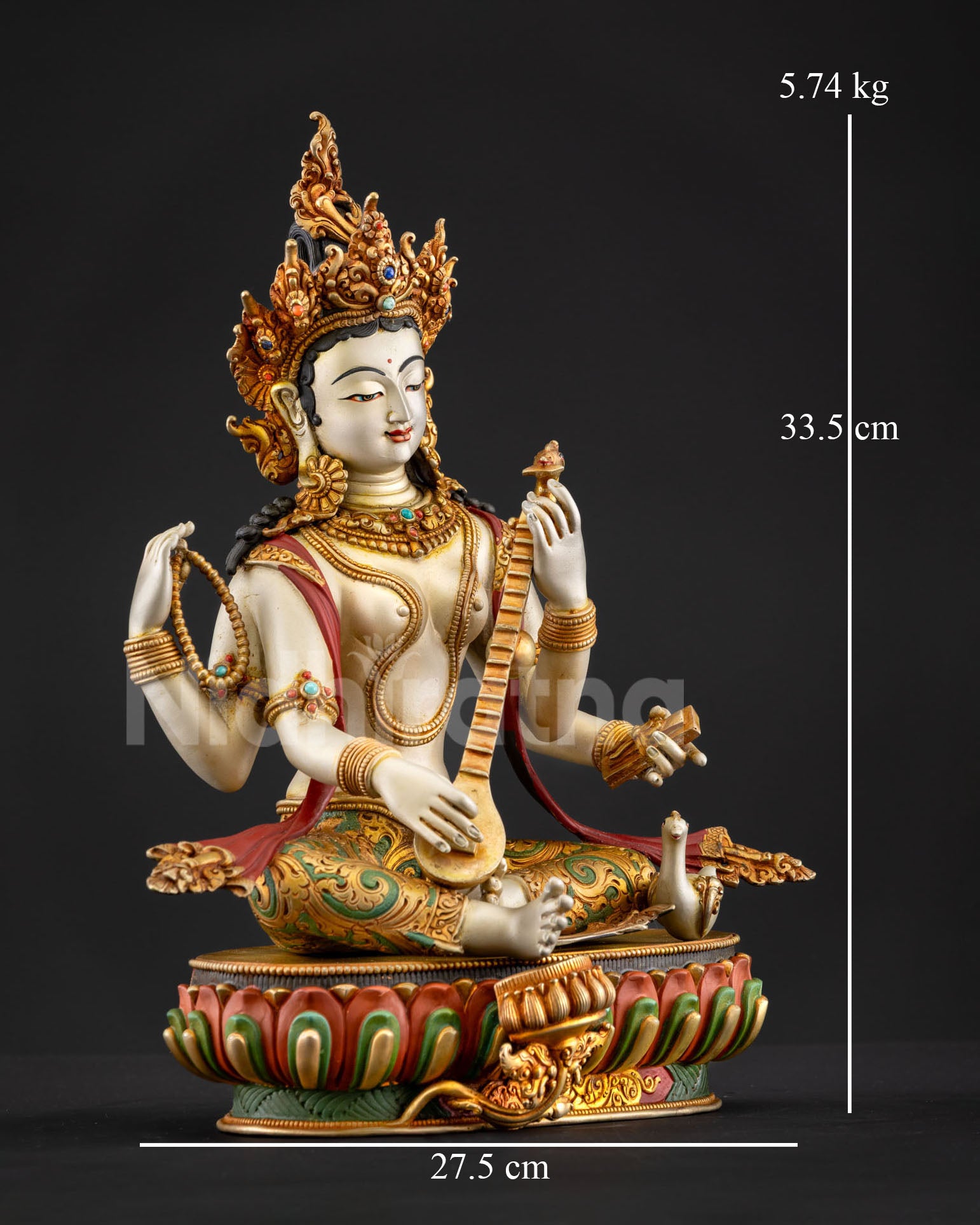 Side view of Saraswati statue, holding veena, Hindu goddess of learning, spiritual creativity, Himalayan copper sculpture sacred altar decor