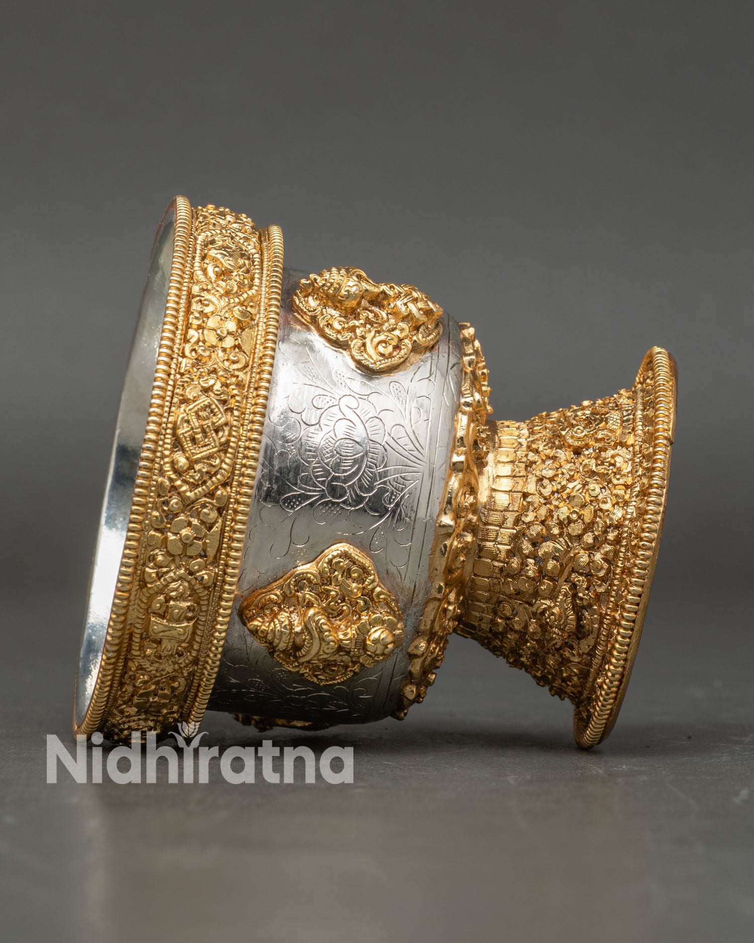 Side view set of seven Tibetan water offering bowls arranged in traditional sequence for Buddhist altar practice with detailed copper structure
