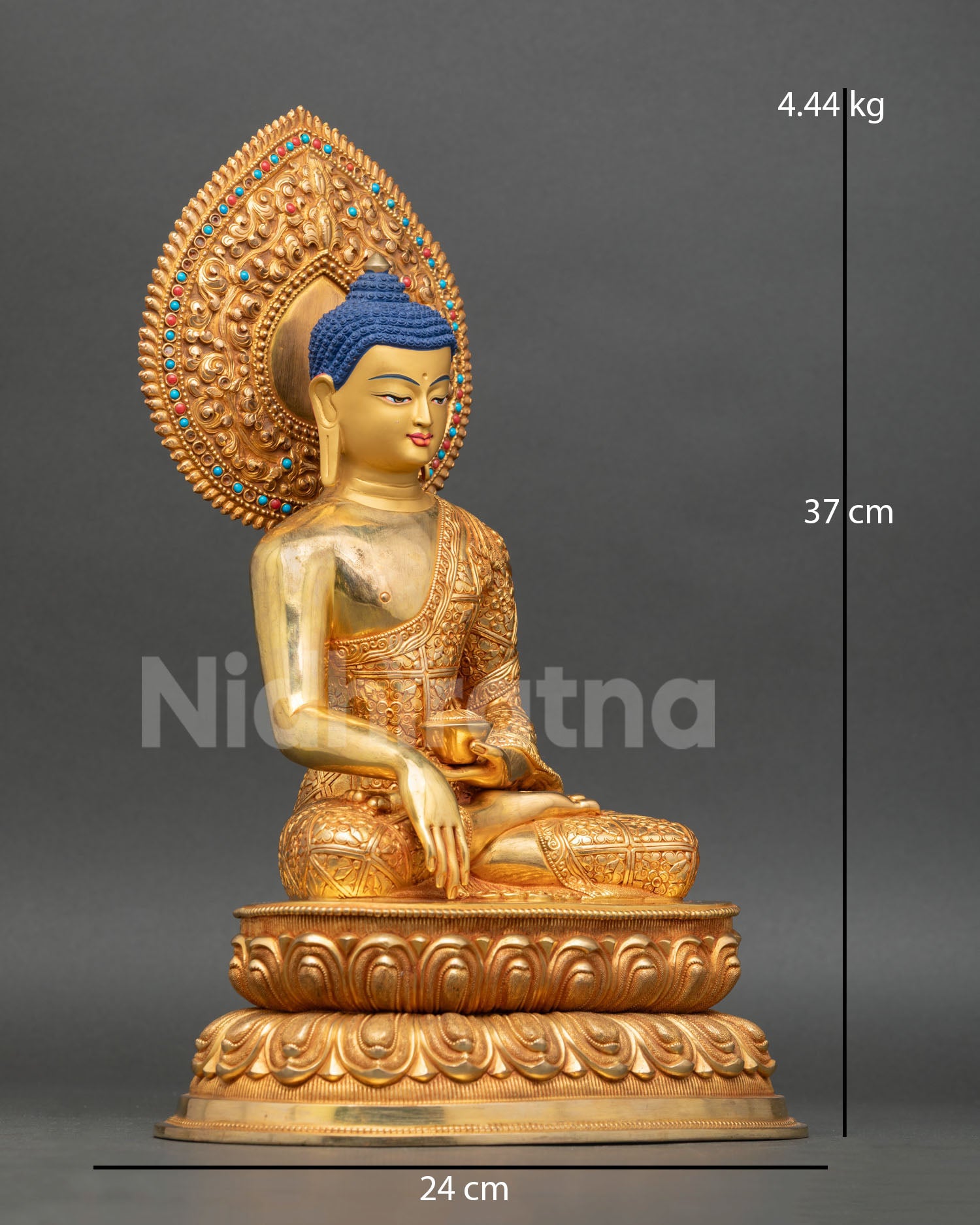 Side view of Shakyamuni Buddha meditation statue seated lotus pedestal monastic robe floral motifs lost wax copper statue Nepal sacred altar art