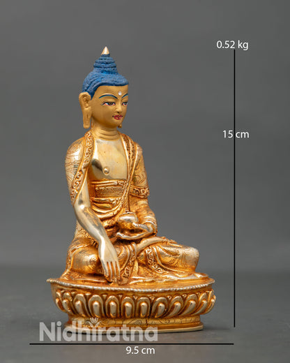 Side view of Shakyamuni Buddha statue earth touching mudra lotus pedestal Buddhist meditation sculpture
