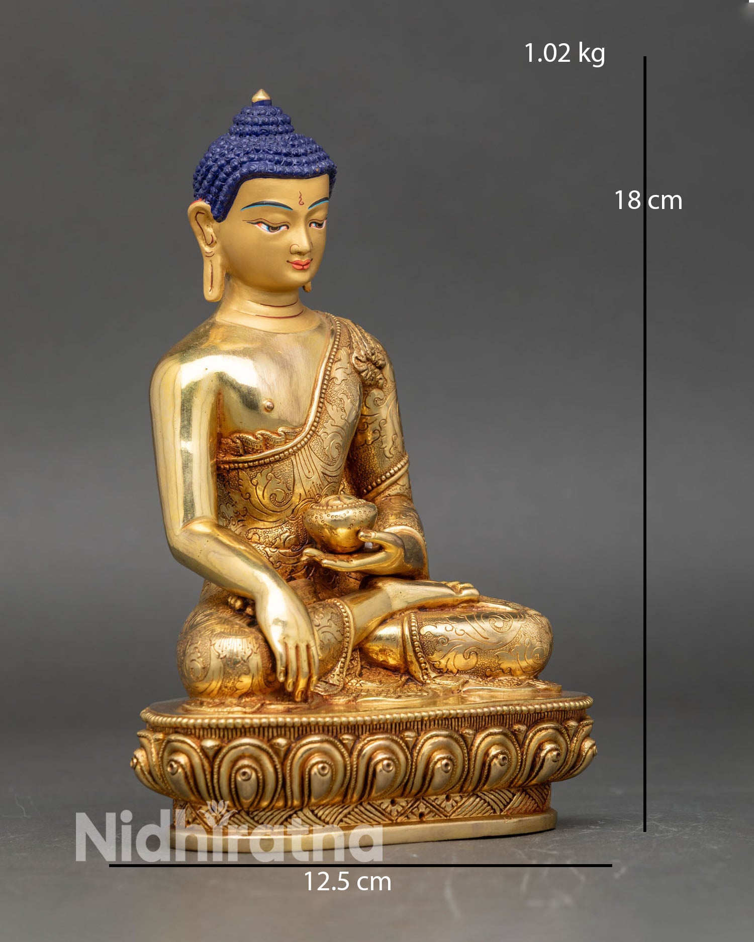 Side view Shakyamuni Buddha statue performing earth-touching mudra on lotus pedestal