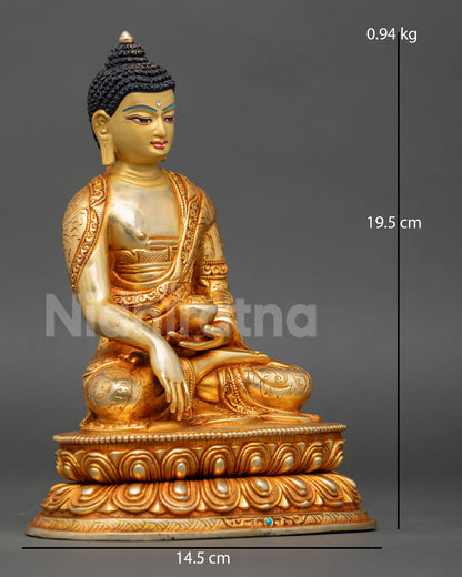 Side view of Shakyamuni Buddha statue seated on lotus throne with Earth Touching Mudra and begging bowl traditional Nepalese Newari craftsmanship