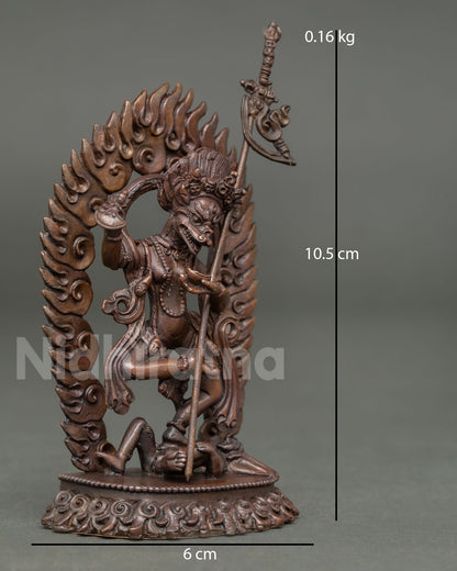 Side view of Simhamukha statue standing in powerful posture with flowing garments sacred attributes and intricate ornaments