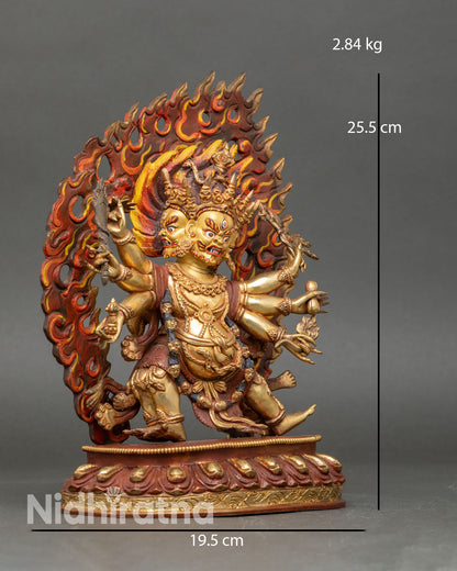 Side view of Six-Armed Mahakala statue holding ritual objects, lotus pedestal Vajrayana protector deity