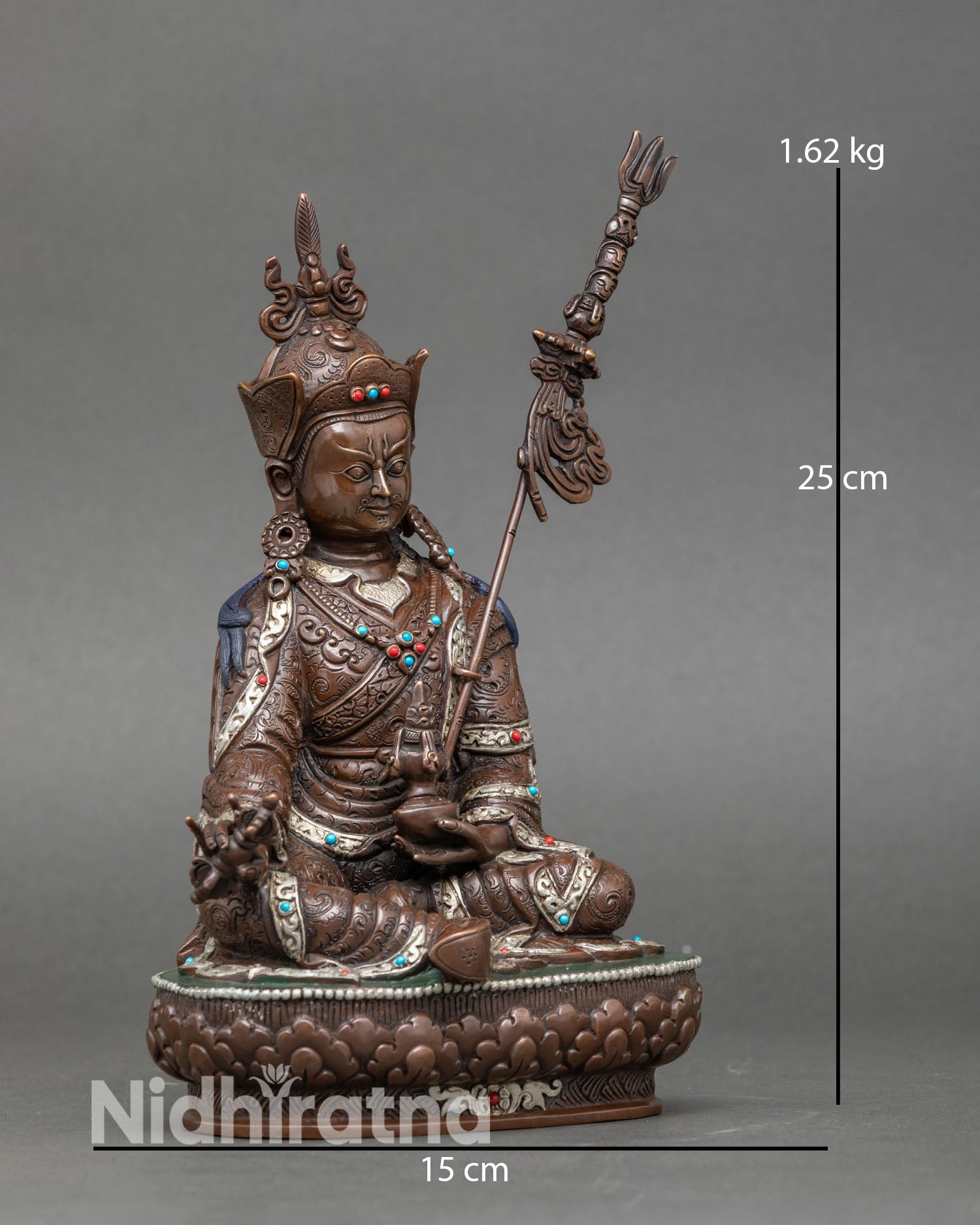 Side view of Tibetan Guru Rinpoche statue with silver plated ornaments handcrafted Nepalese Buddhist master sculpture for meditation altar
