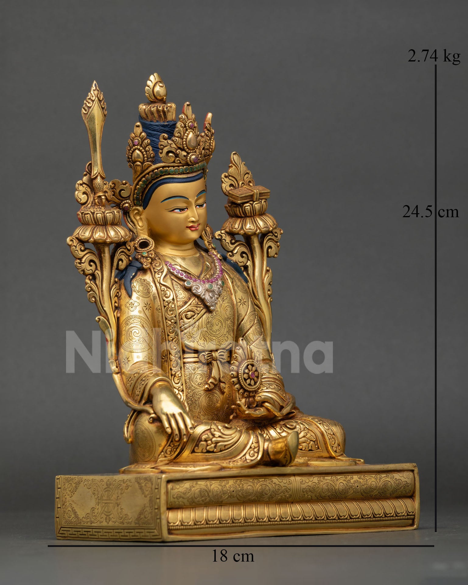 Side view of Trisong Detsen statue holding Dharma wheel with Varada Mudra and ornate monastic robes in Himalayan Buddhist art style