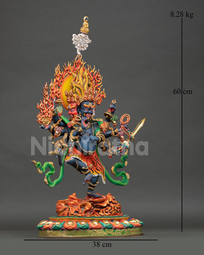 Side view of Ucchusma statue draped in tiger skin garment standing on multi colored lotus pedestal with vibrant hand painted details