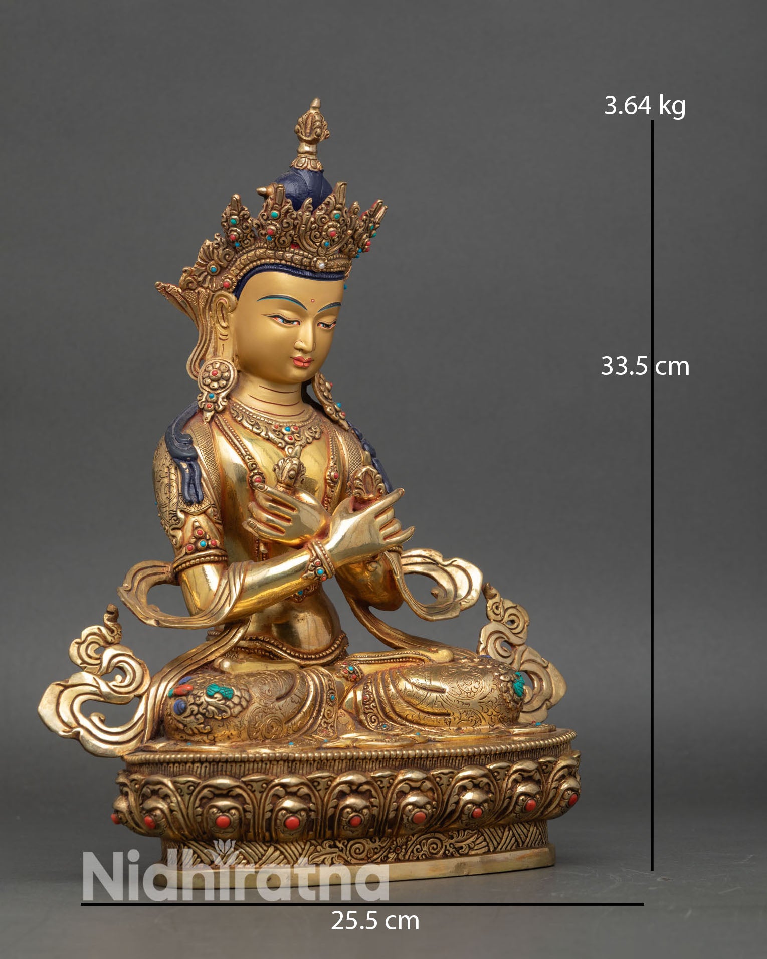 Side view of Vajradhara statue vajra bell crossed arms meditation Buddhist art