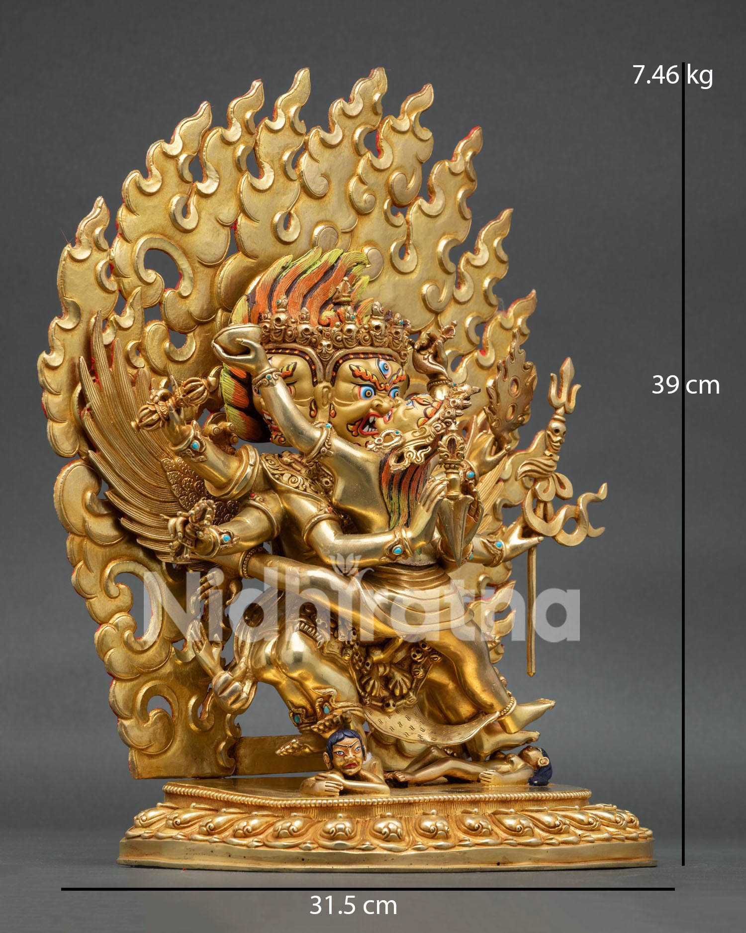 Side view of Vajrakilaya Buddhist statue with phurba and flaming halo detail
