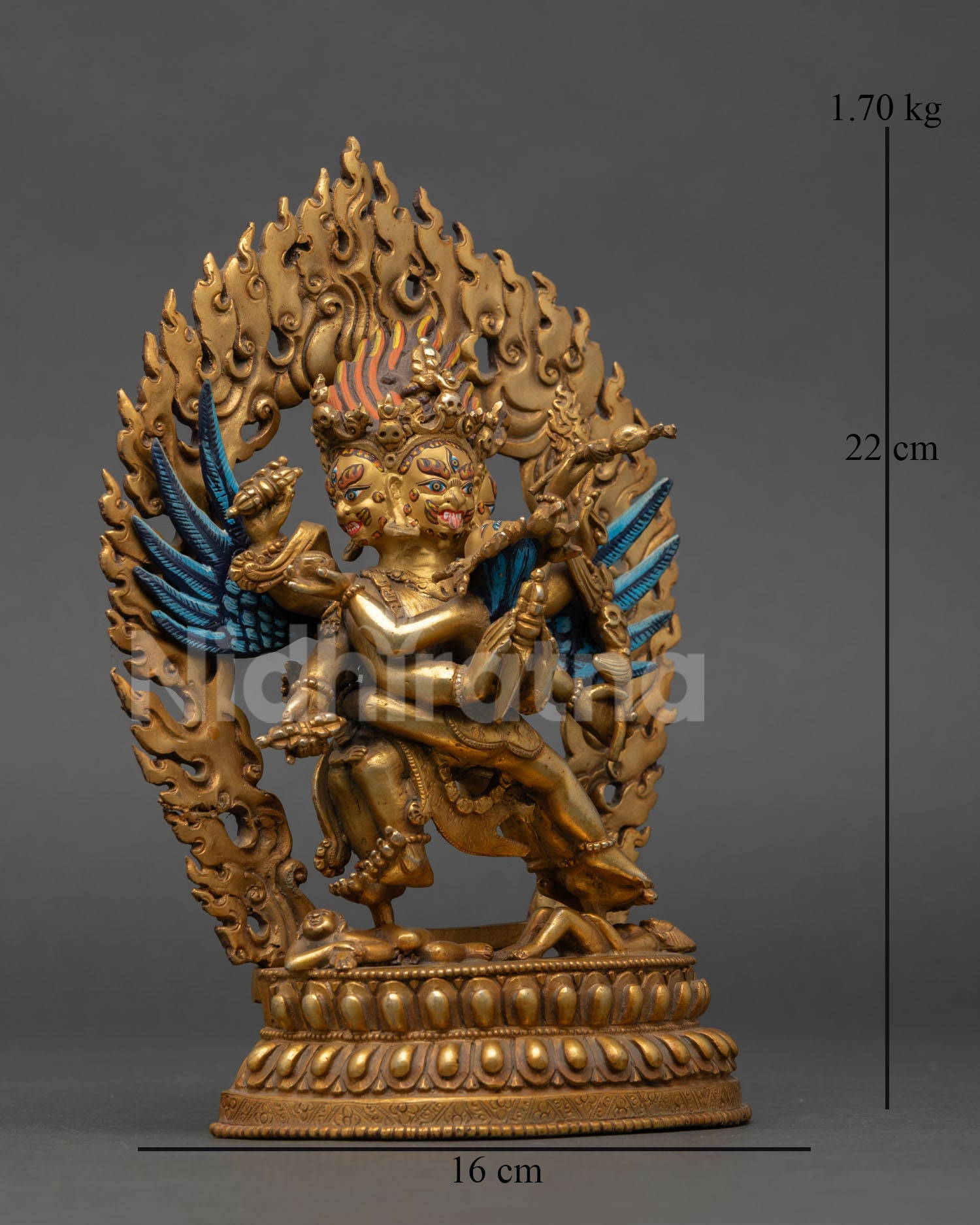 Side view of Vajrakilaya statue holding phurba with consort holding skull cup and kartika knife representing wisdom and compassionate action