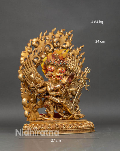 Side view of Vajrakilaya statue with consort, central phurba, skull cup, and kartika knife.