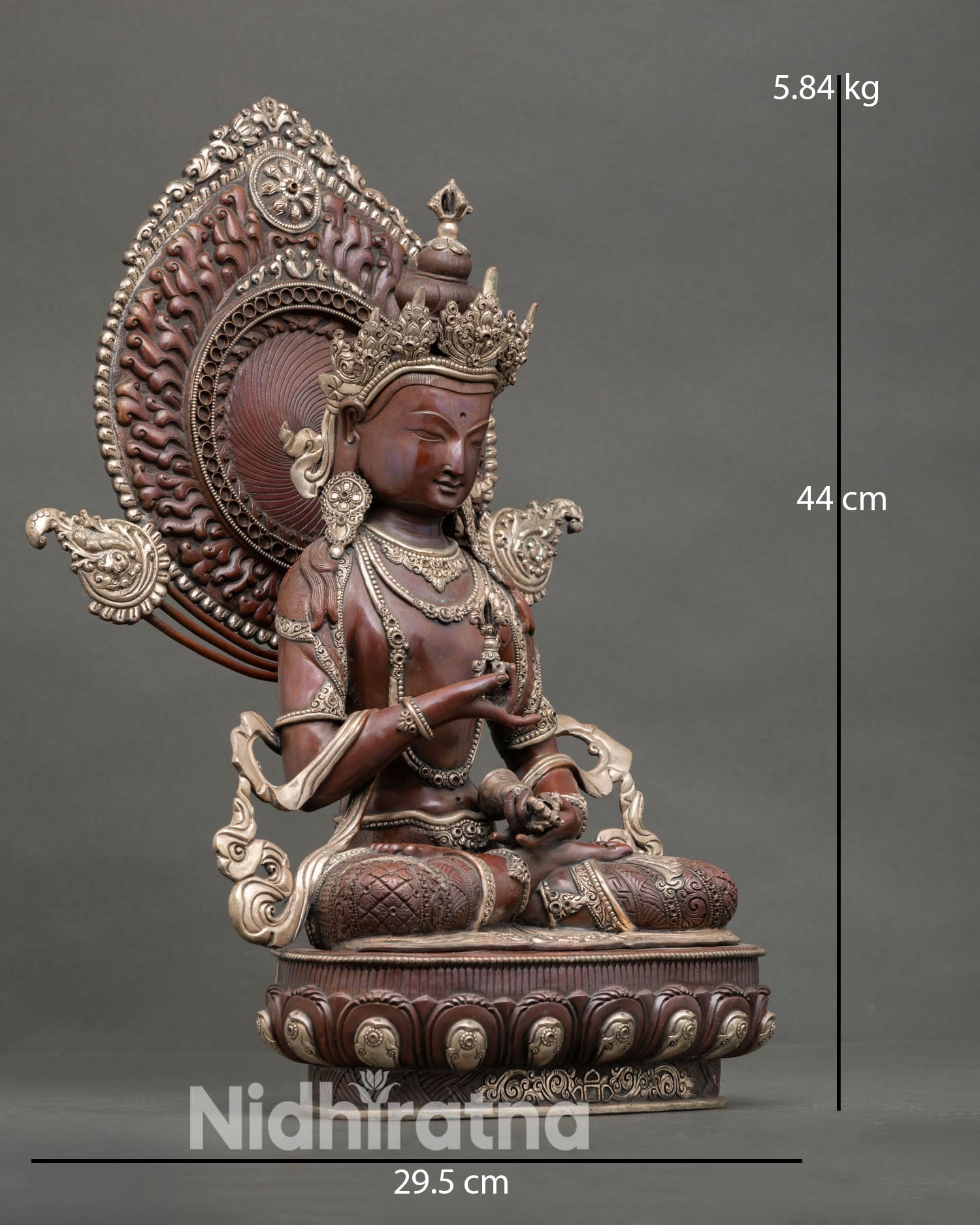 Side view of Vajrasattva sacred statue showing detailed Himalayan craftsmanship oxidized copper body silver plated finish and intricate ritual symbolism