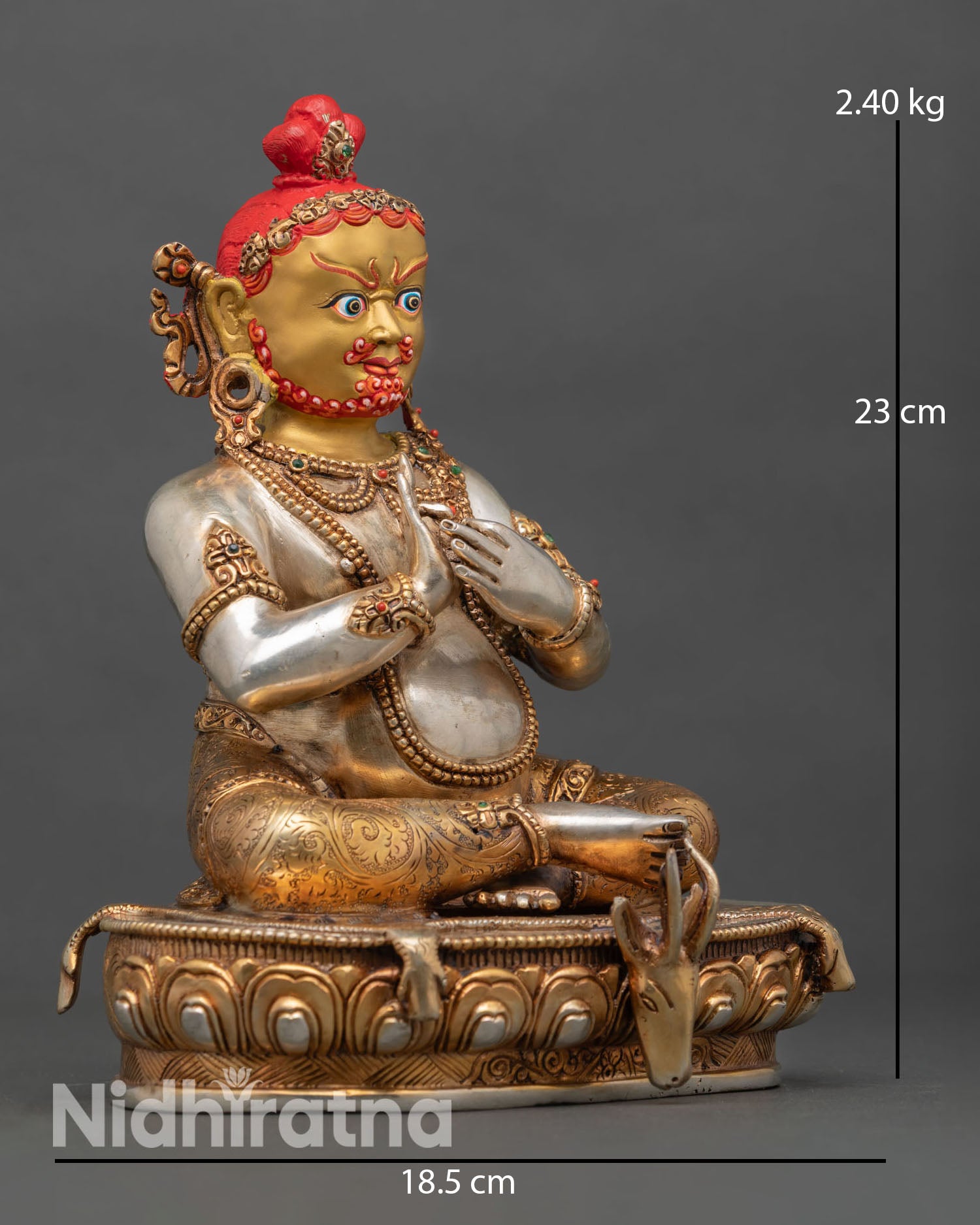 Side view of Virupa statue seated on lotus throne deer skin and Dharmachakra mudra hand gesture detail