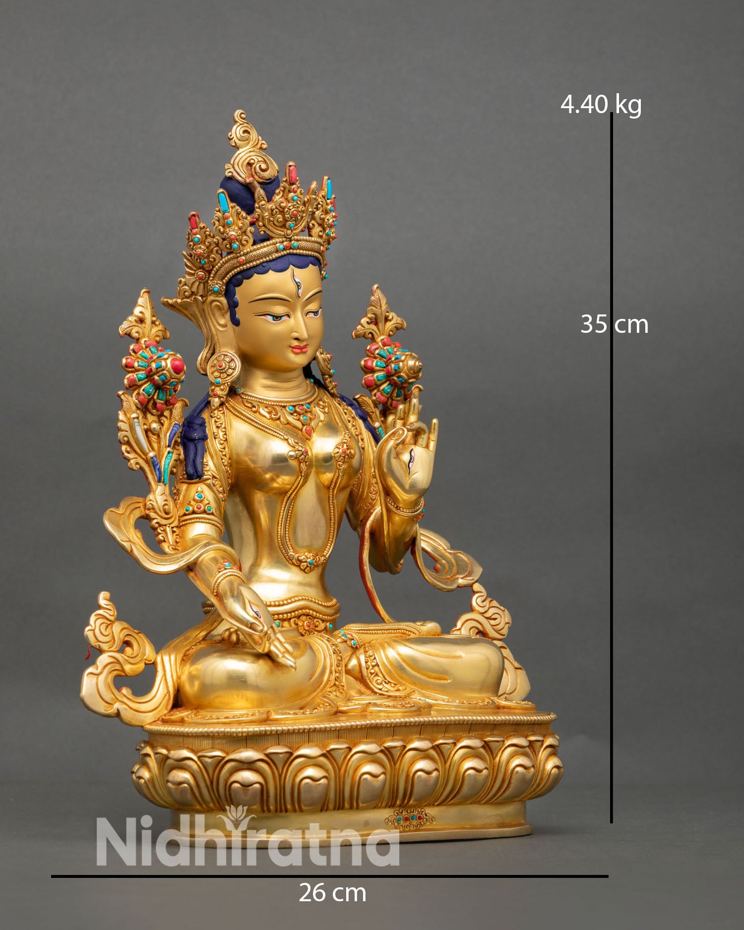 Side view of White Tara Buddhist statue showing intricate lost wax craftsmanship and sacred ornaments