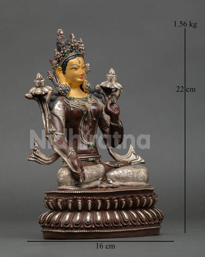 Side view of White Tara meditation statue silver plated finish seated posture ornamented jewelry Tibetan Buddhist compassion goddess