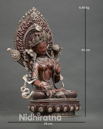 Side view of White Tara statue showing detailed crown sacred jewelry flowing robes and lotus flower with traditional Nepalese craftsmanship