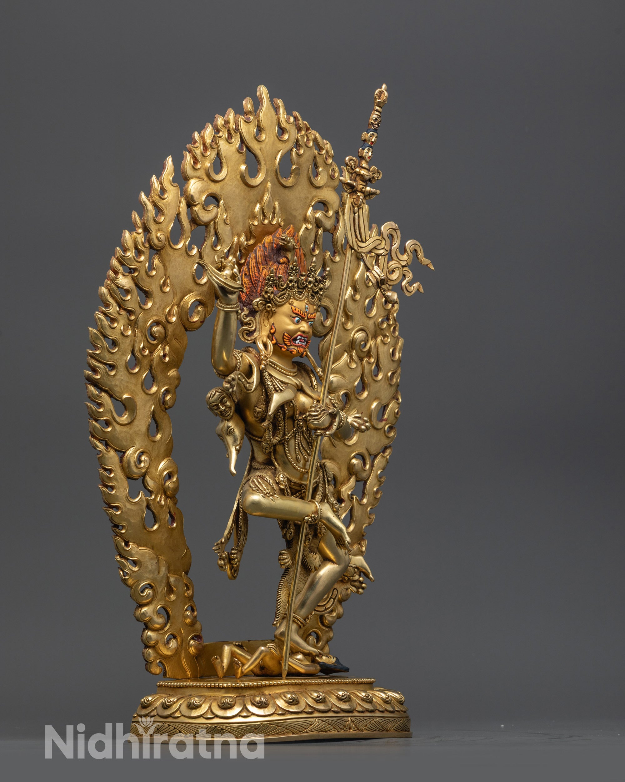 side angle Troma Nagmo Black Wrathful Mother statue with fiery halo and lotus seat
