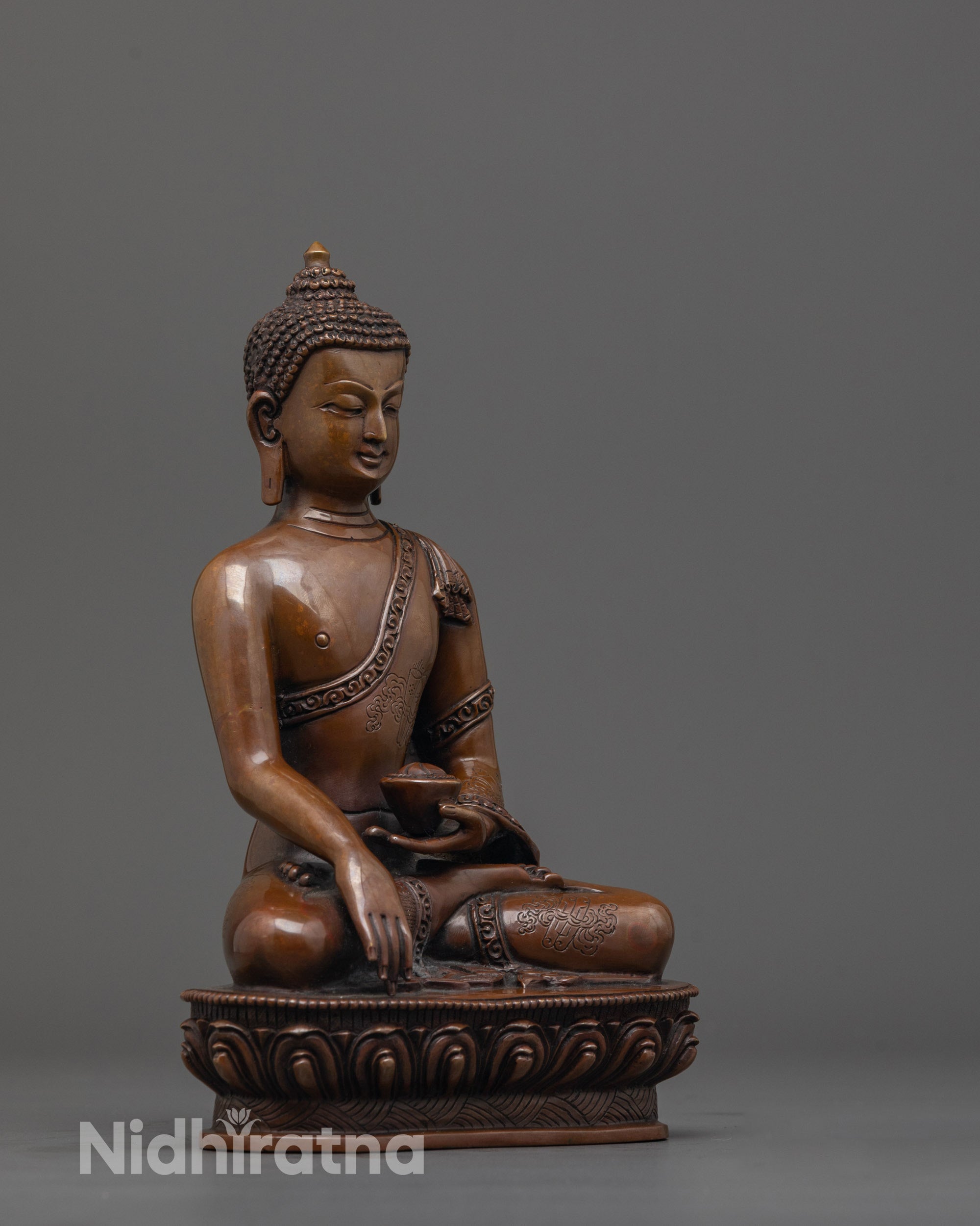 side angle of Shakyamuni Buddha Statue showing carved dharma wheel and deer on lotus seat