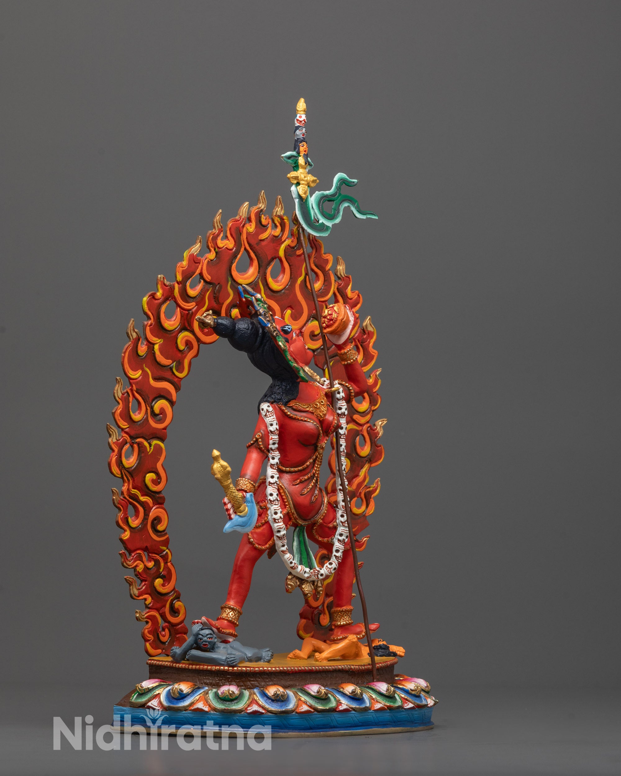 side angle of Vajrayogini statue showing dynamic posture and flowing robe design