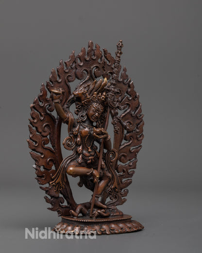 side angle of dorje phagmo statue with intricate flowing robes and bold deity-crushing pose
