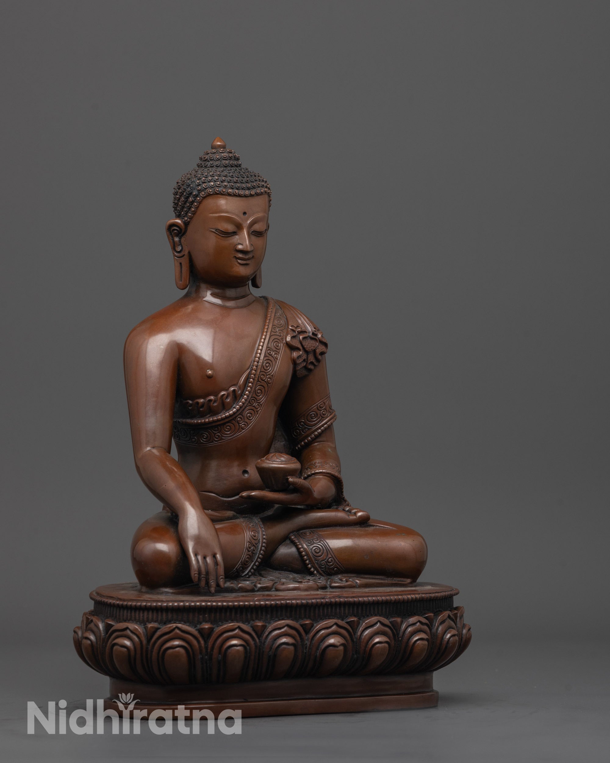 side angle of handcrafted Gautama Buddha statue holding patra bowl in bhumisparsha mudra