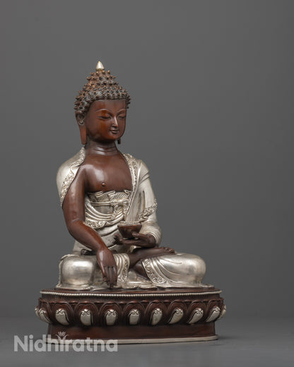 side angle of handcrafted oxidized copper face and silver-plated robe of buddha statue