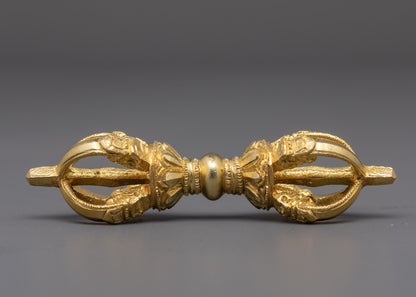 side angle of handcrafted vajra showing intricate gold-plated copper finish
