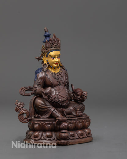 side angle of machine-made Dzambhala statue showing electroplated copper finish