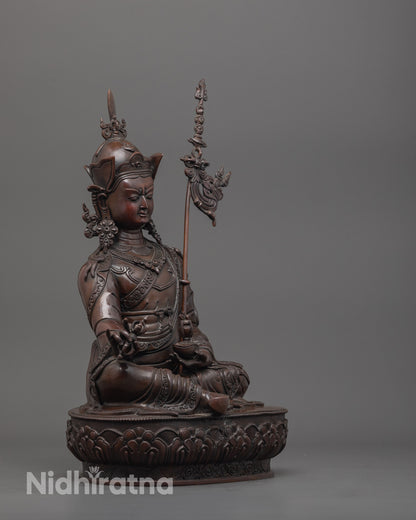 side angle of spiritual guru rinpoche statue with lotus base and oxidized copper finish