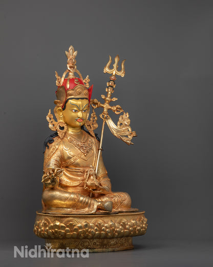 side angle showing Guru Rinpoche holding skull cup and trident with detailed robes