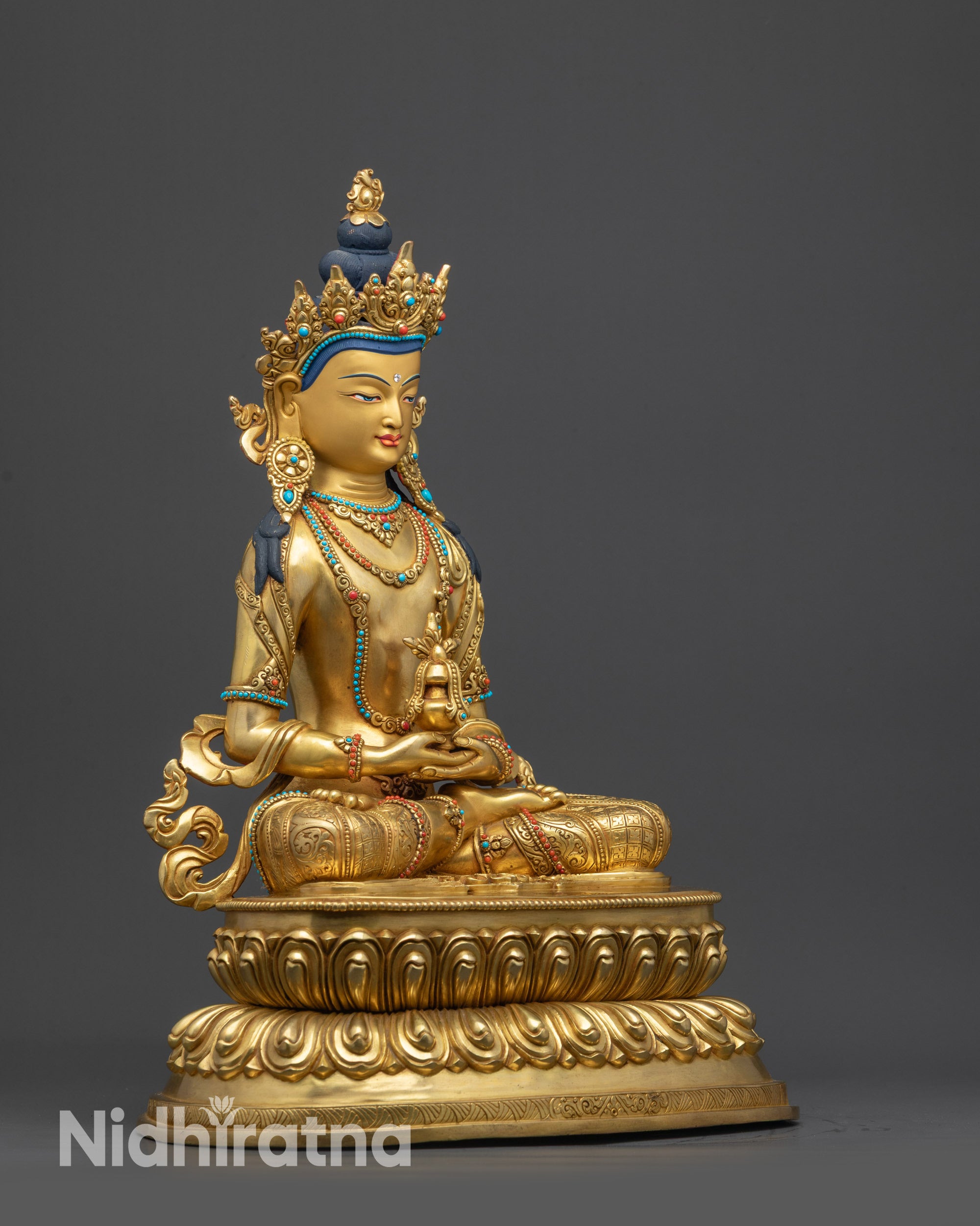 side close up face Amitayus Buddha statue gold-gilded craftsmanship from Nepal
