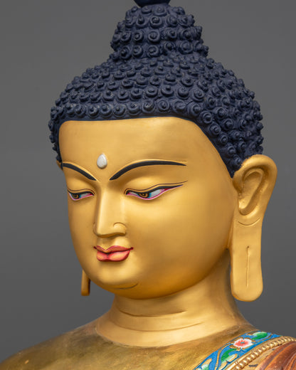 side close up face of Shakyamuni Buddha Statue with gold-gilded calm expression