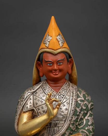 khedrup je statue face close up with yellow pandita hat serene expression and gold gilded features nepal