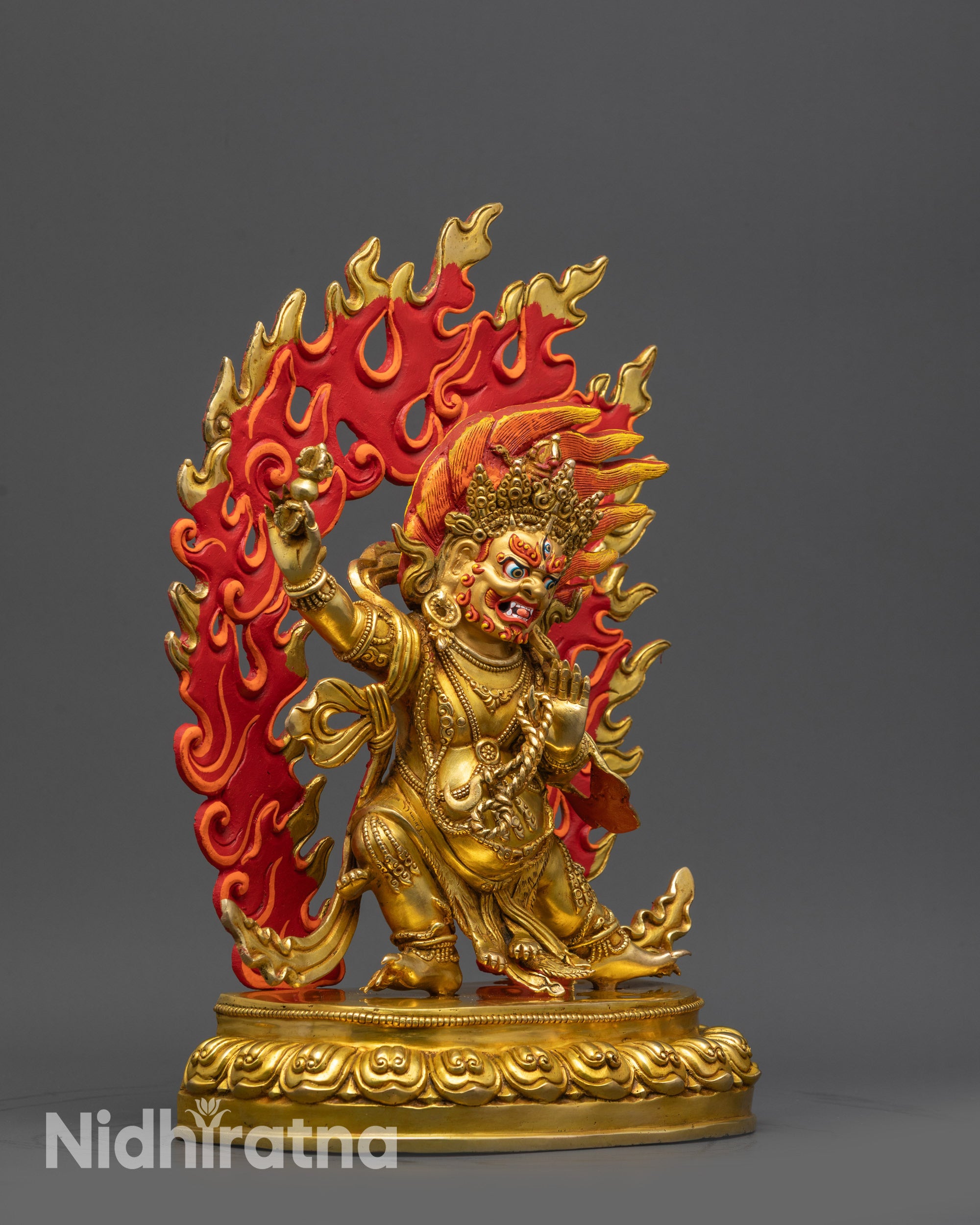 side view Chana Dorje statue with swirling robes and ornate garments on a lotus seat display