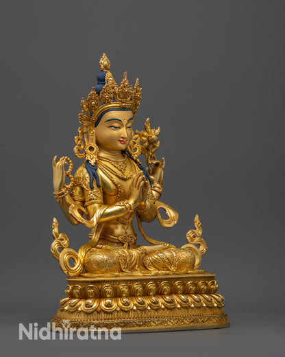 side view Four-Armed Chenrezig sculpture showing lotus and mala held in upper hands
