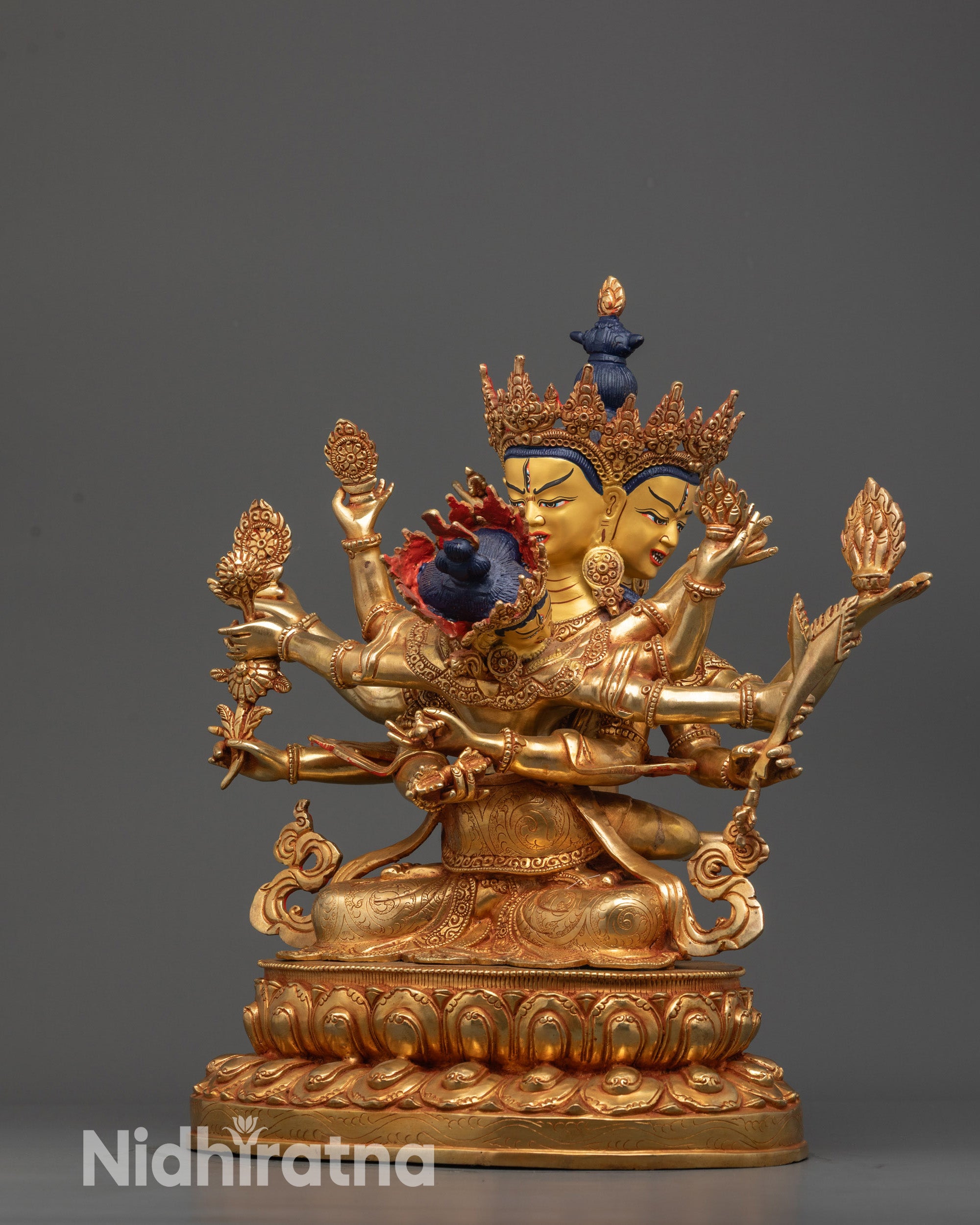 side view Guhyasamaja and Sparshavajra union statue holding vajra bell lotus
