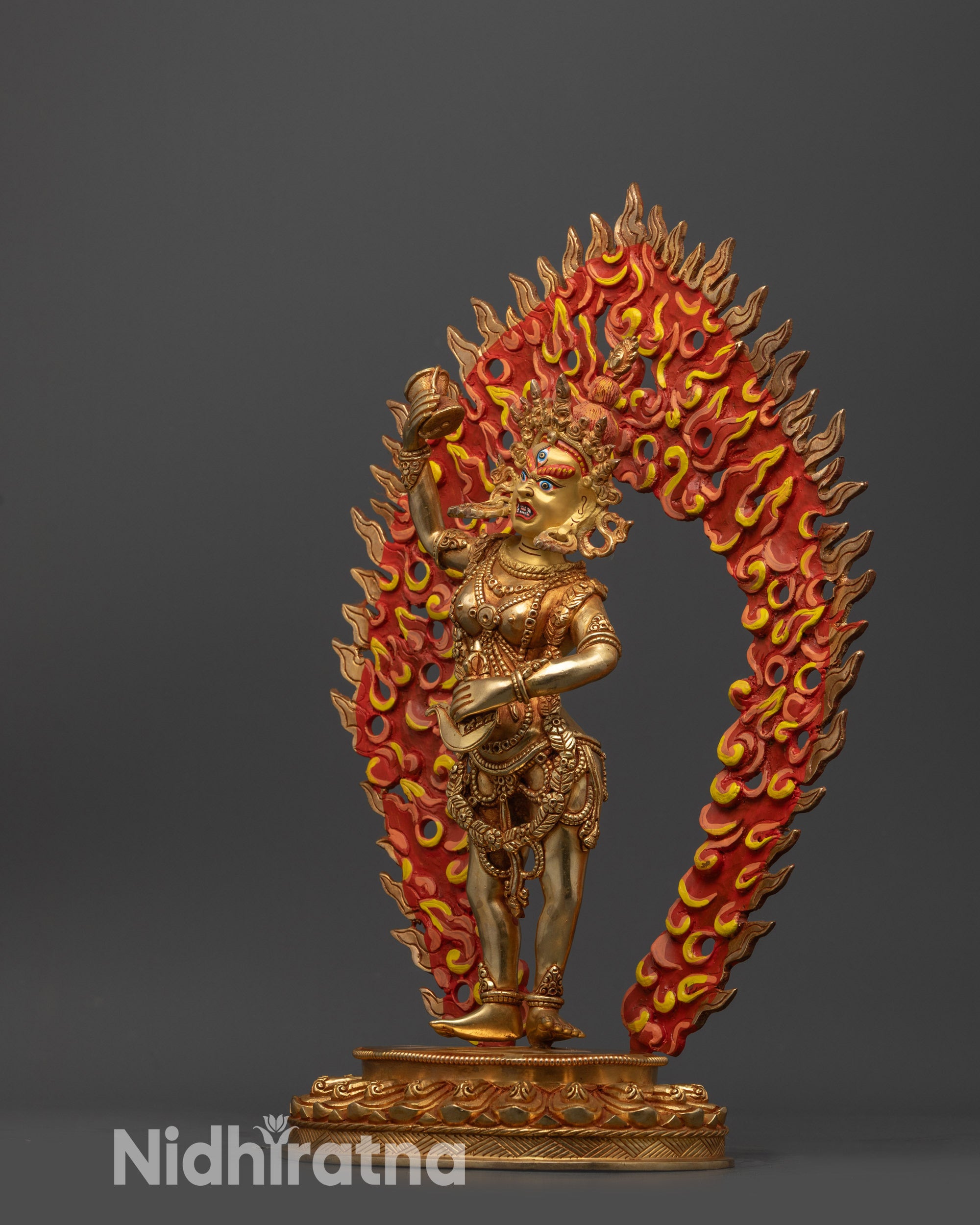 side view Nepalese Dechen Gyalmo statue holding kartika knife and damaru drum
