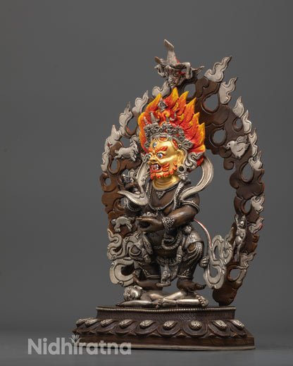 side view Sakya Mahakala statue with oxidized copper body and serpent garland accent