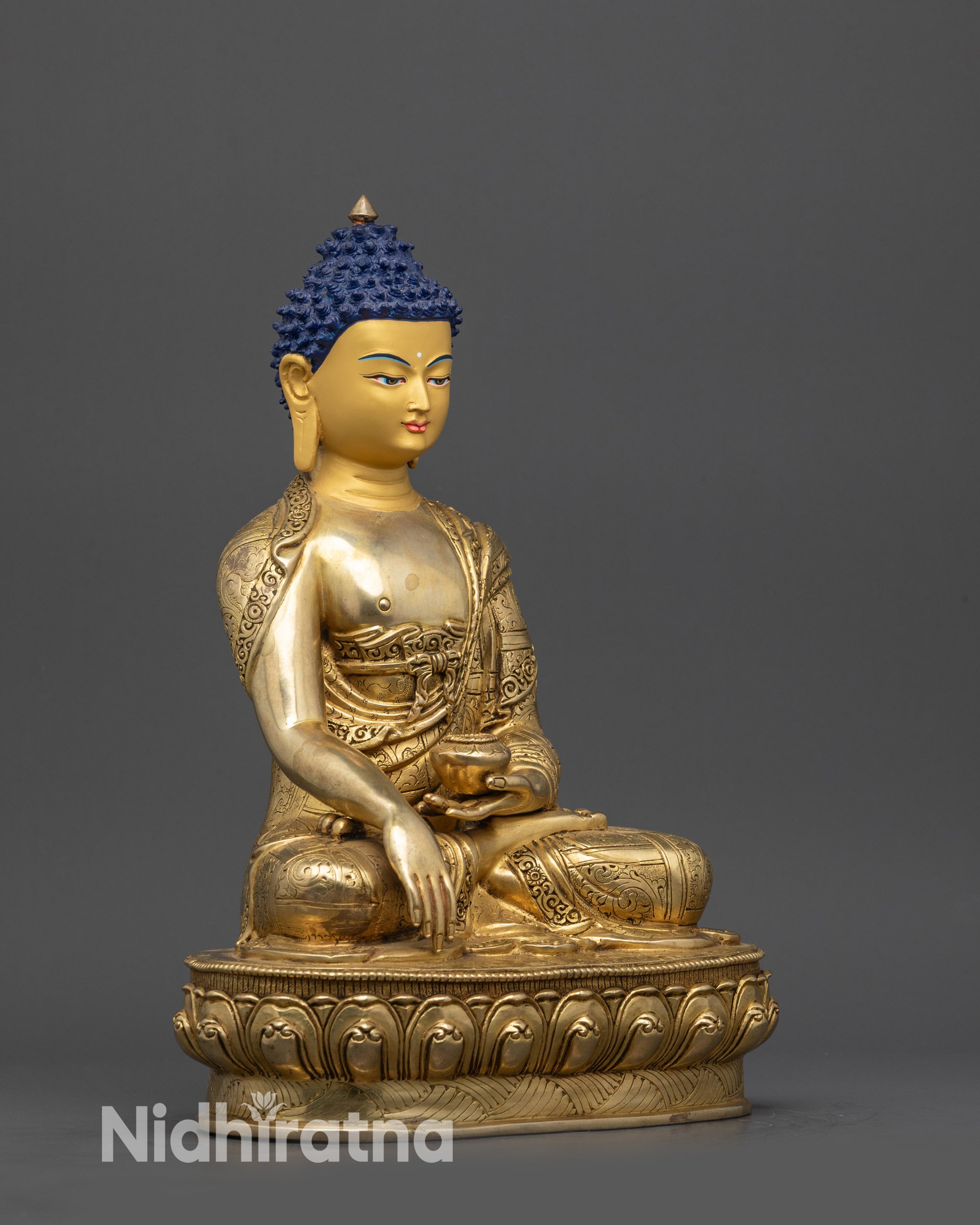 side view Shakyamuni Buddha statue showing intricate robe and patterns
