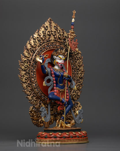 side view Simhamukha Statue holding kartaika knife, skull cup, and khatvanga trident
